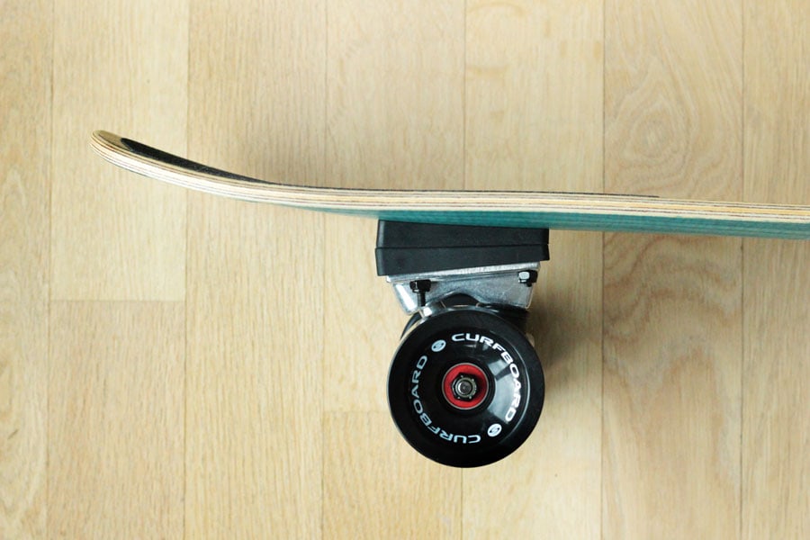 Side view of the back truck of the Curfboard x Soulboardiy surfskate.