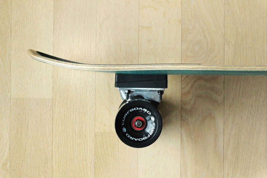 Side view of the back truck of the Curfboard x Soulboardiy surfskate.