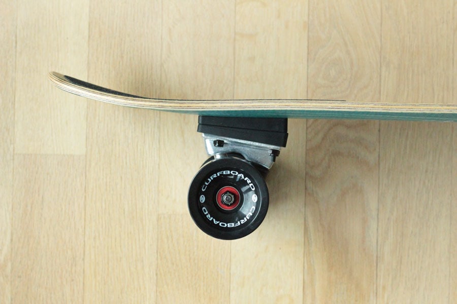 Side view of the back truck of the Curfboard x Soulboardiy surfskate.